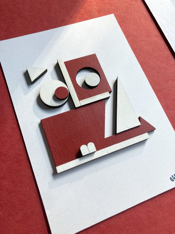 Tableau en mosaïque de contreplaqué blanche et rouge.