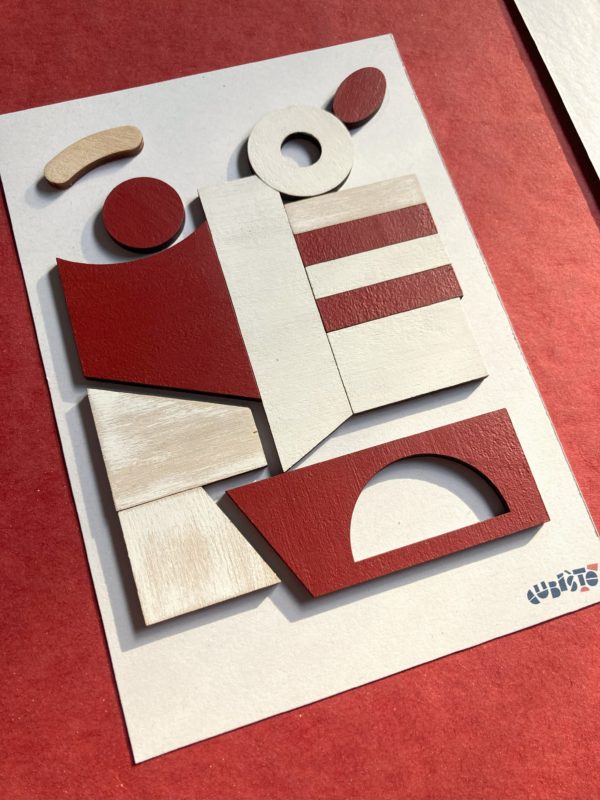 Tableau en mosaïque de contreplaqué blanche et rouge.